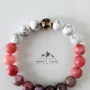 Alpenglow Bracelet with white, pink, purple, and silver beads inspired by Alaska mountain light